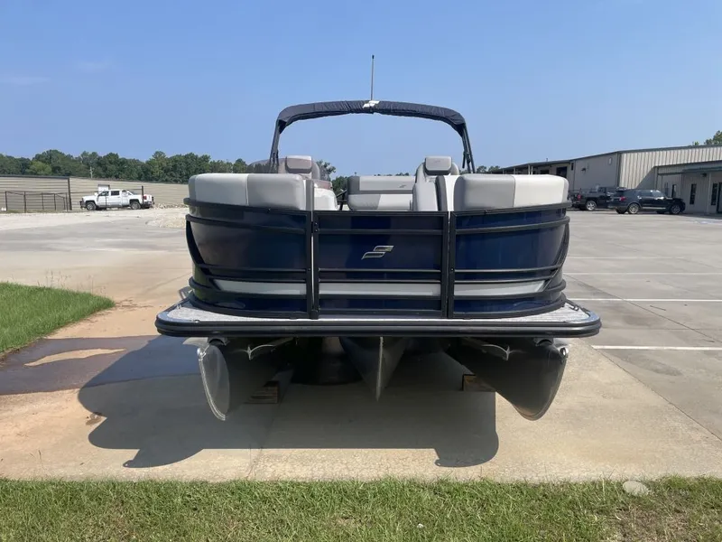 Slide: The Image of The image shows a 2026 Starcraft EXS 3 Q DH pontoon boat parked on a lot. - 4