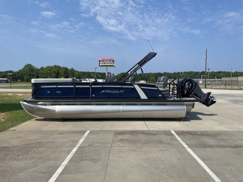 The Image of A modern pontoon boat by Starcraft, model EXS 3 Q DH, year 2026, parked on a lot. - 1