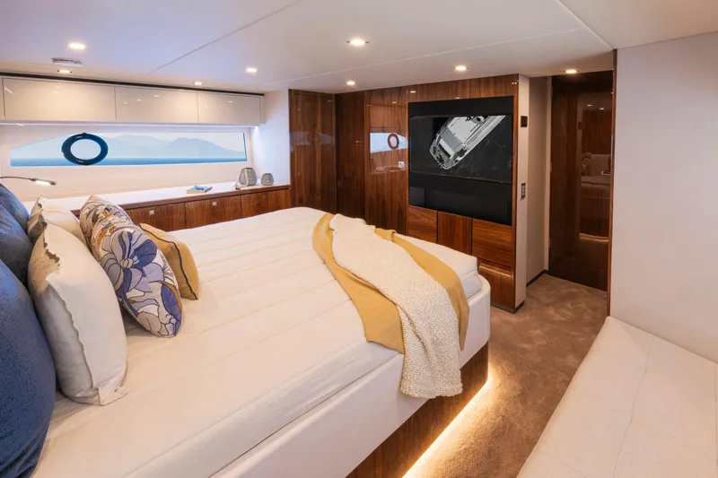 Slide: The Image of Luxurious bedroom interior of 2026 Riviera 5600 Sport Yacht Platinum Edition. - 4