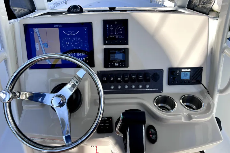 Slide: The Image of 2023 Boston Whaler 220 Dauntless boat interior with stainless steel cup holders. - 20
