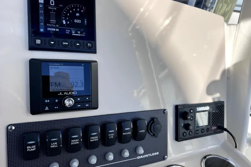 Slide: The Image of Power-Pole shallow water anchor on 2023 Boston Whaler 220 Dauntless boat. - 23