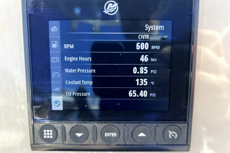 Slide: The Image of 2023 Boston Whaler 220 Dauntless boat interior with seating and storage compartments. - 26