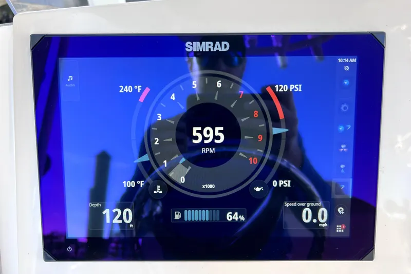 Slide: The Image of 2023 Boston Whaler 220 Dauntless boat interior with seating and storage features. - 27