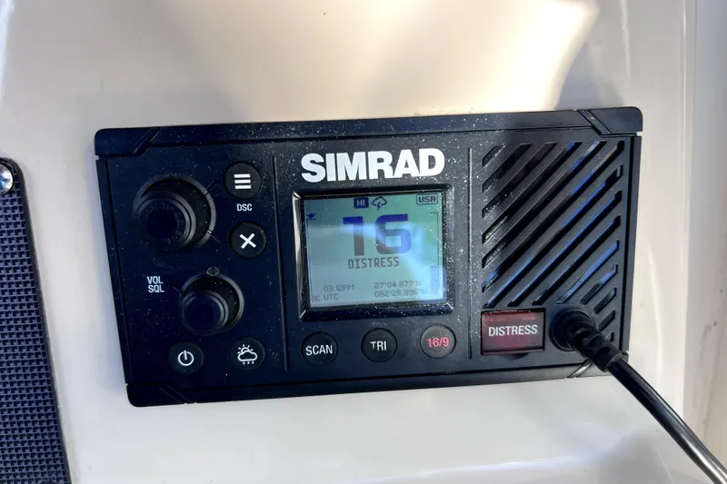 Slide: The Image of 2023 Boston Whaler 220 Dauntless dashboard with steering wheel and electronic displays. - 31