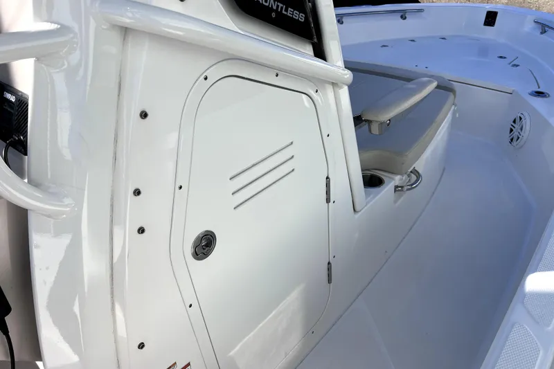Slide: The Image of 2023 Boston Whaler 220 Dauntless helm with navigation display and steering wheel. - 32