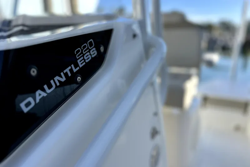 Slide: The Image of Compass on 2023 Boston Whaler 220 Dauntless boat dashboard, close-up view. - 35
