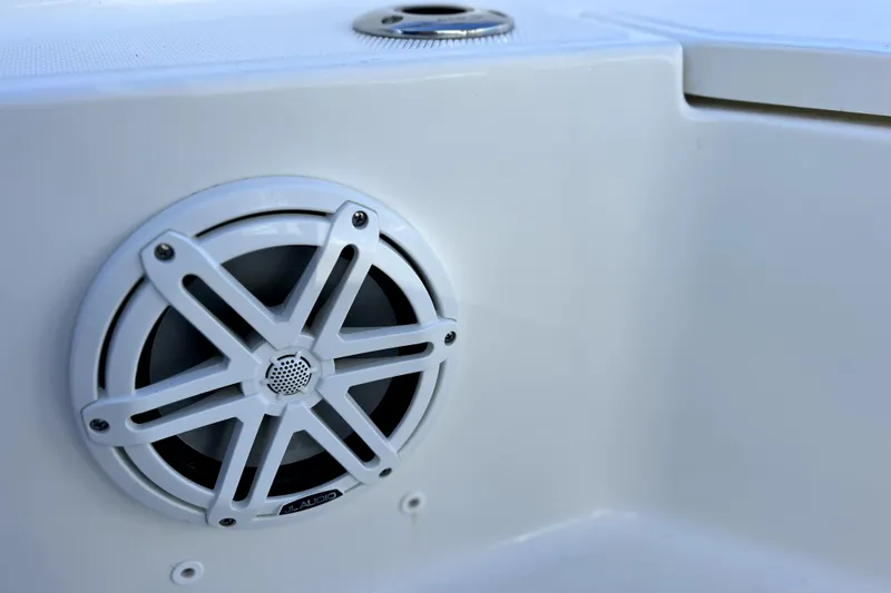 Slide: The Image of Simrad marine radio on 2023 Boston Whaler 220 Dauntless, displaying distress channel 16. - 42