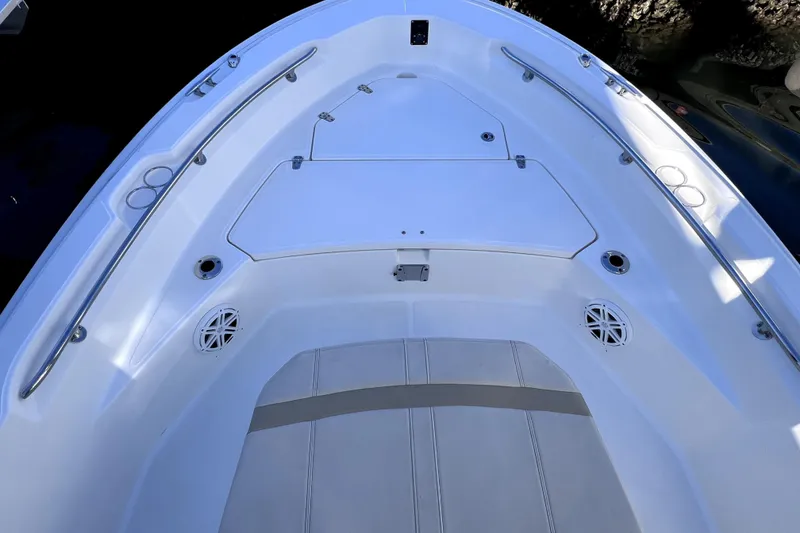 Slide: The Image of 2023 Boston Whaler 220 Dauntless interior, featuring seating and storage compartment. - 43