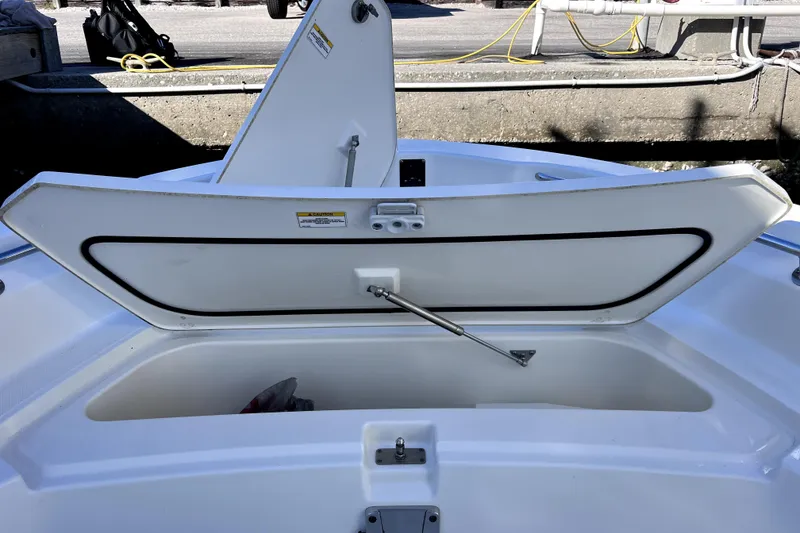 Slide: The Image of 2023 Boston Whaler 220 Dauntless waste disposal port, chrome finish. - 45