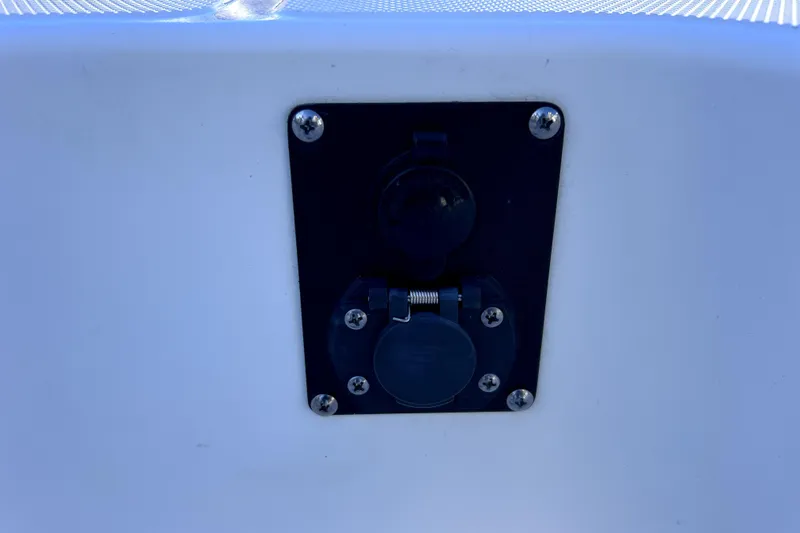 Slide: The Image of 2023 Boston Whaler 220 Dauntless boat interior with sleek railing and white deck. - 52