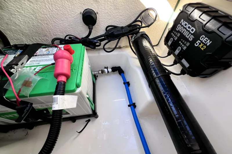 Slide: The Image of Open storage compartment on a 2023 Boston Whaler 220 Dauntless boat. - 56