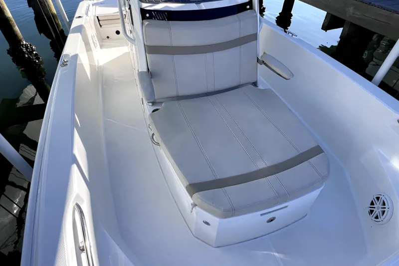 Slide: The Image of 2023 Boston Whaler 220 Dauntless boat interior with cushioned seating. - 59
