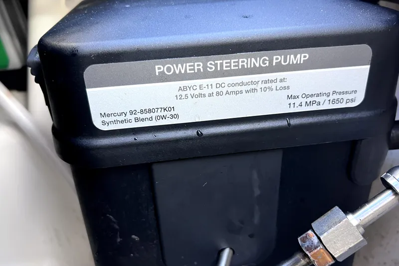 Slide: The Image of Power steering pump label on 2023 Boston Whaler 220 Dauntless, detailing specifications and pressure ratings. - 65
