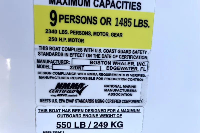 Slide: The Image of 2023 Boston Whaler 220 Dauntless capacity label, 9 persons or 1485 lbs, 250 HP motor. - 68