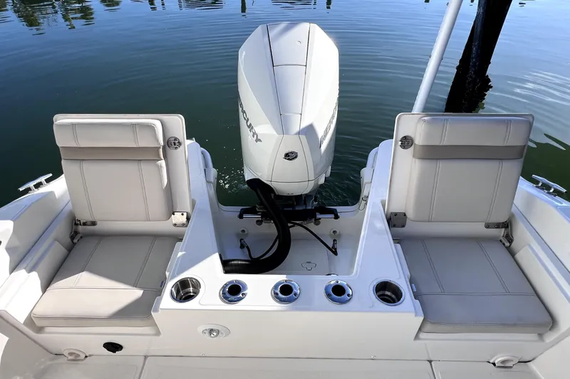 Slide: The Image of 2023 Boston Whaler 220 Dauntless boat cruising on calm water. - 8