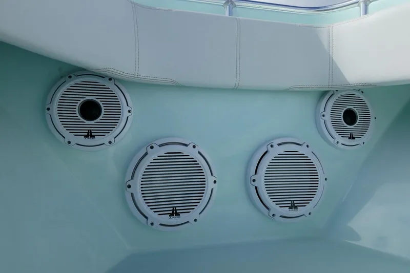 Slide: The Image of 2025 Contender 39 ST boat speakers with white grilles and cushioned seating. - 10