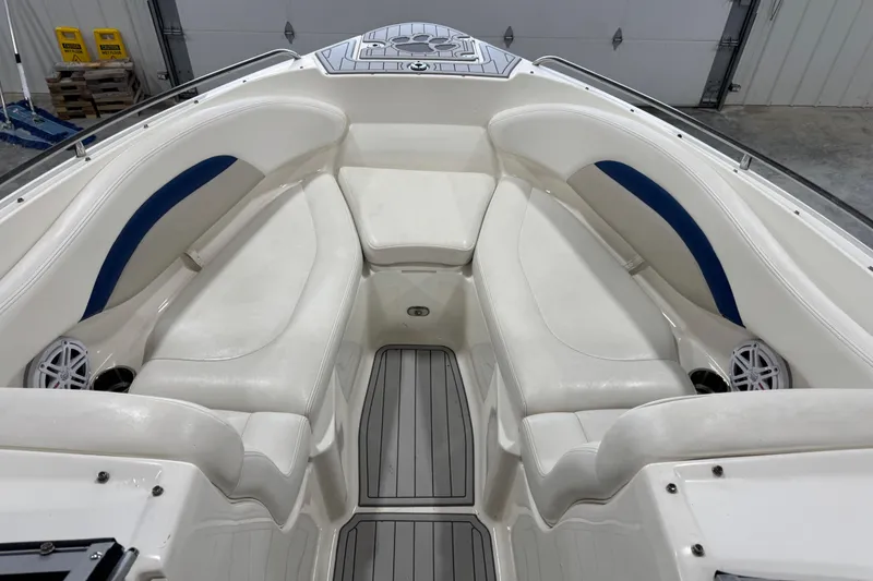 Slide: The Image of 2007 Chaparral 256 SSi boat interior with white seating and blue accents. - 10