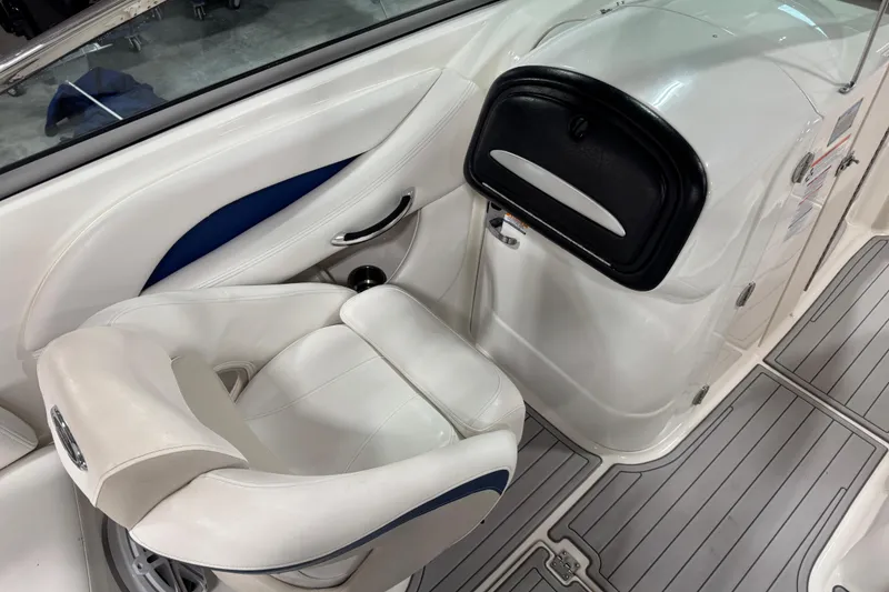 Slide: The Image of 2007 Chaparral 256 SSi boat interior with white seating and sleek design. - 8