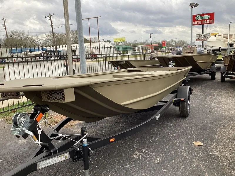 Slide: The Image of Safety and capacity labels on a G3 Gator Tough 15 DK boat. - 15