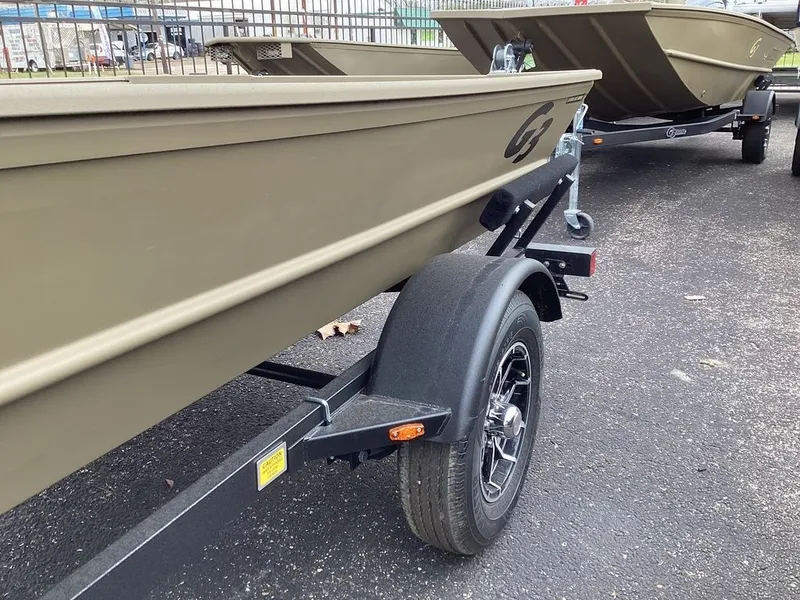 Slide: The Image of Open storage compartment on a 2026 G3 Gator Tough 15 DK boat. - 19