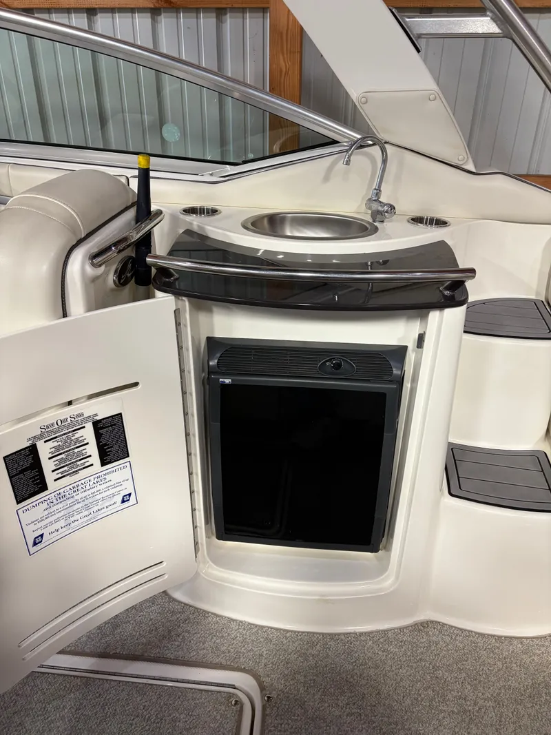 Slide: The Image of Interior of 2007 Sea Ray 270 SLX with sink and fridge. - 13
