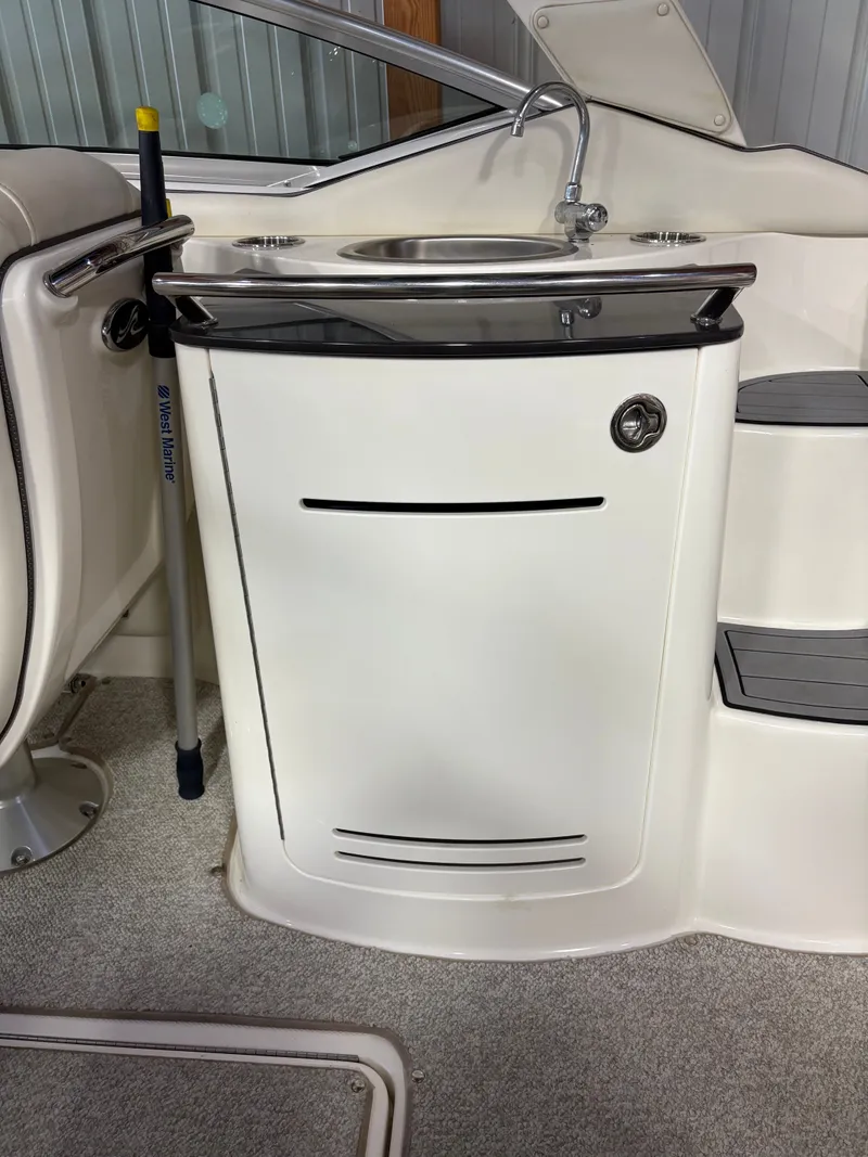 Slide: The Image of Interior of 2007 Sea Ray 270 SLX with sink and storage. - 14