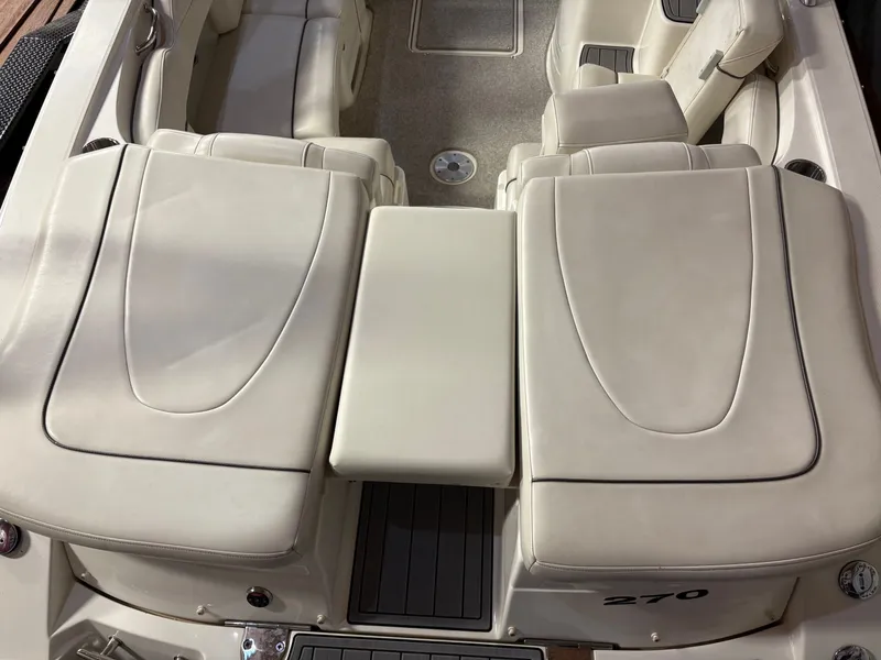 Slide: The Image of Interior of a 2007 Sea Ray 270 SLX boat with beige seating. - 16
