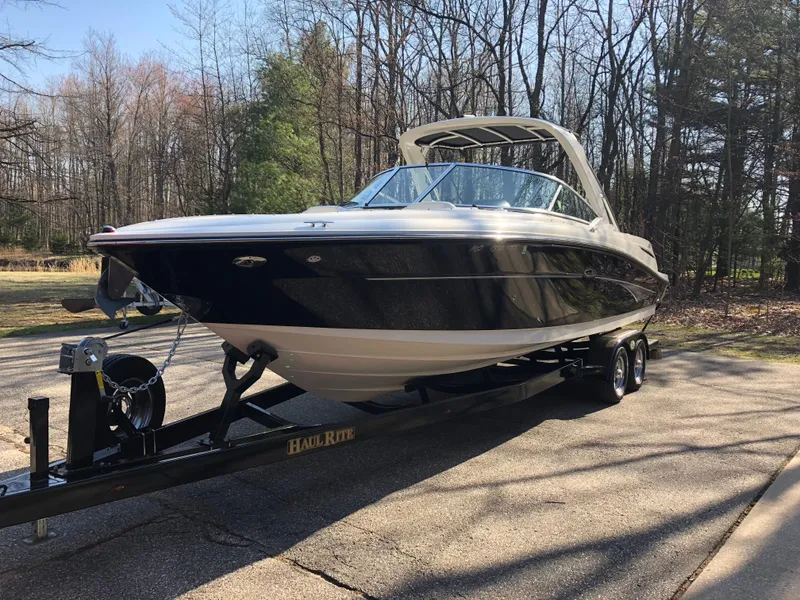Slide: The Image of 2007 Sea Ray 270 SLX boat on trailer in wooded area. - 7