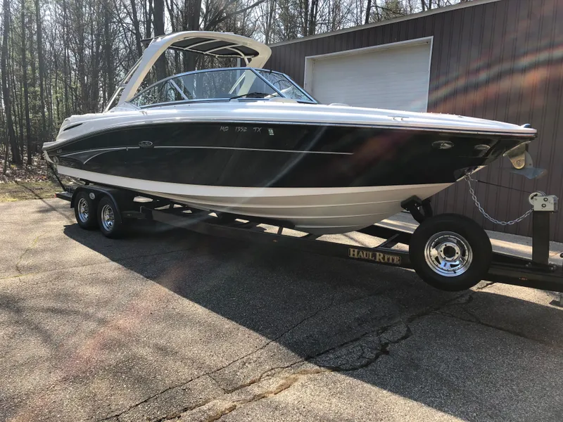 Slide: The Image of 2007 Sea Ray 270 SLX boat on trailer outdoors. - 8