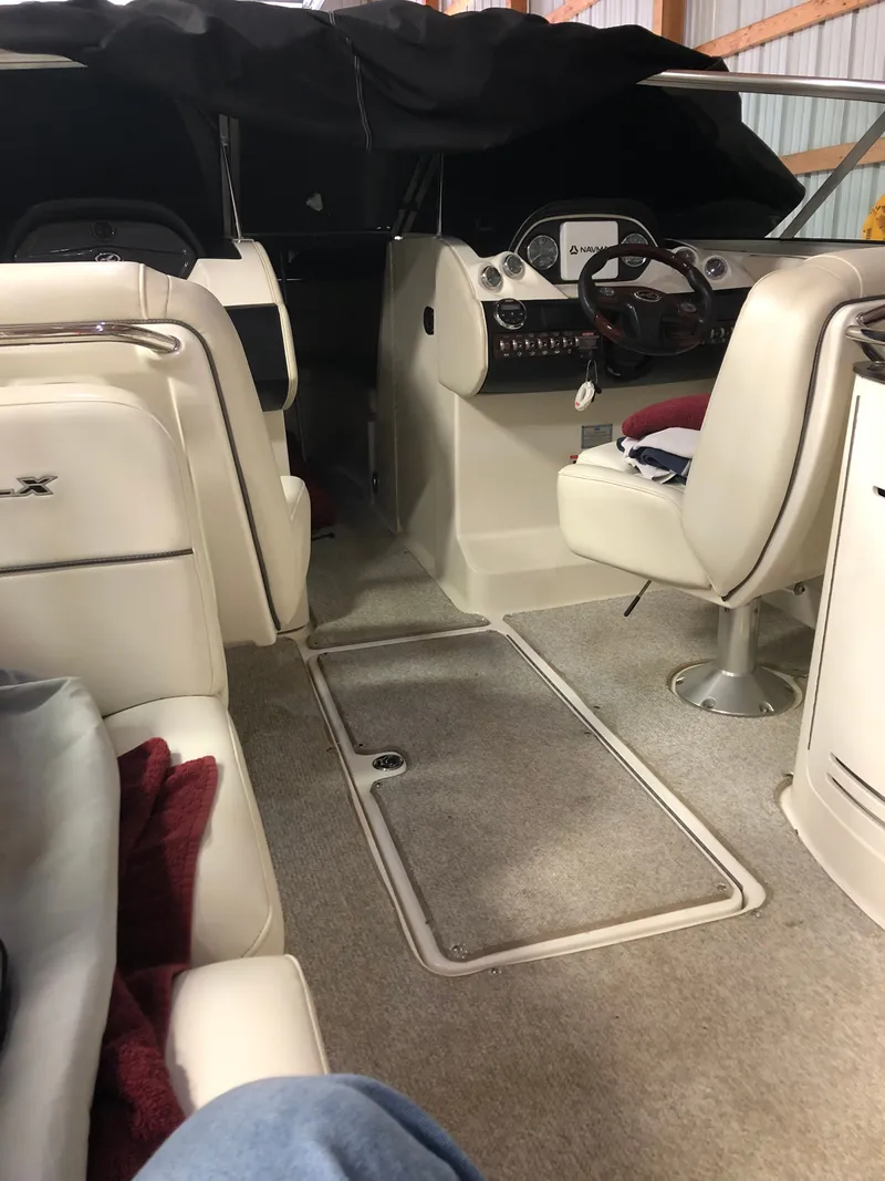 Slide: The Image of Interior of a 2007 Sea Ray 270 SLX boat with white seating. - 9