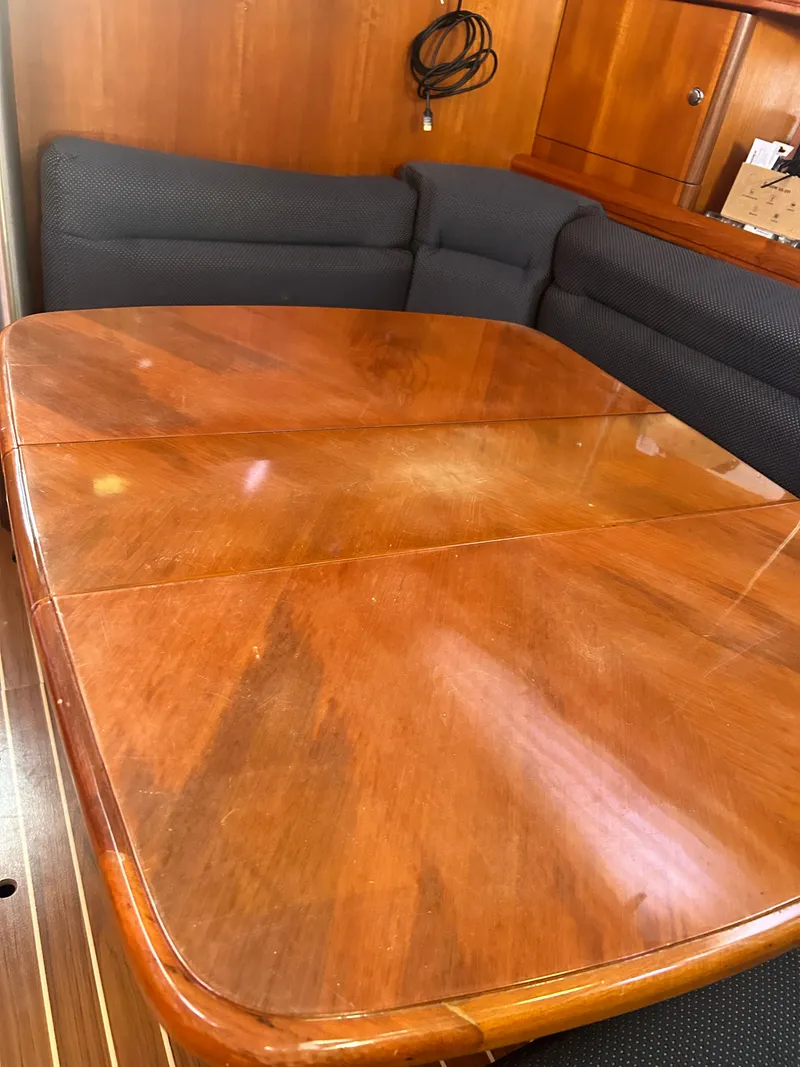 Slide: The Image of Interior of a 2006 Hunter 38 Ft Sloop with wooden table. - 31
