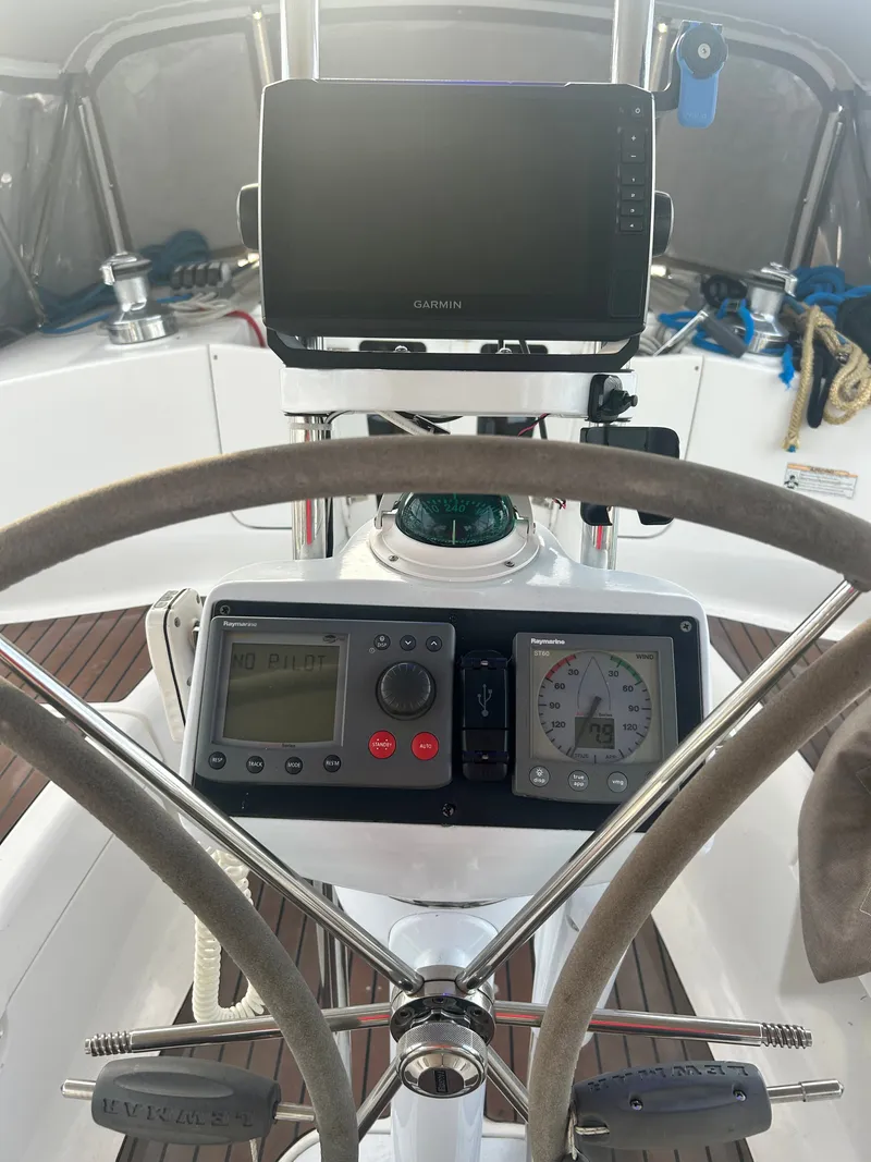 Slide: The Image of Cockpit of a 2006 Hunter 38 Ft Sloop with navigation instruments. - 9
