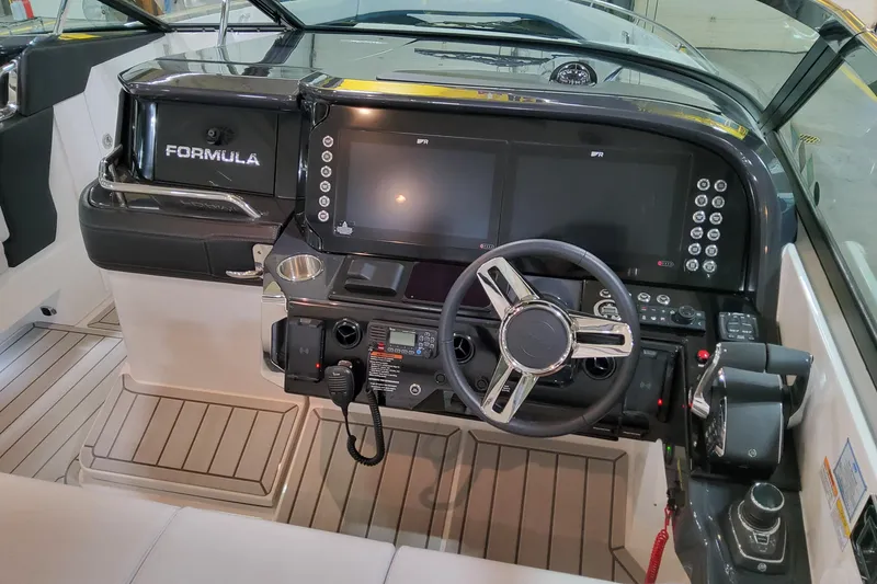 Slide: The Image of 2026 Formula 360 Crossover Bowrider OB dashboard with modern controls and steering wheel. - 13