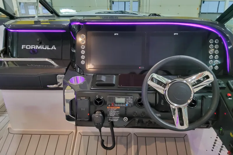 Slide: The Image of 2026 Formula 360 Crossover Bowrider OB dashboard with illuminated controls and modern steering wheel. - 14