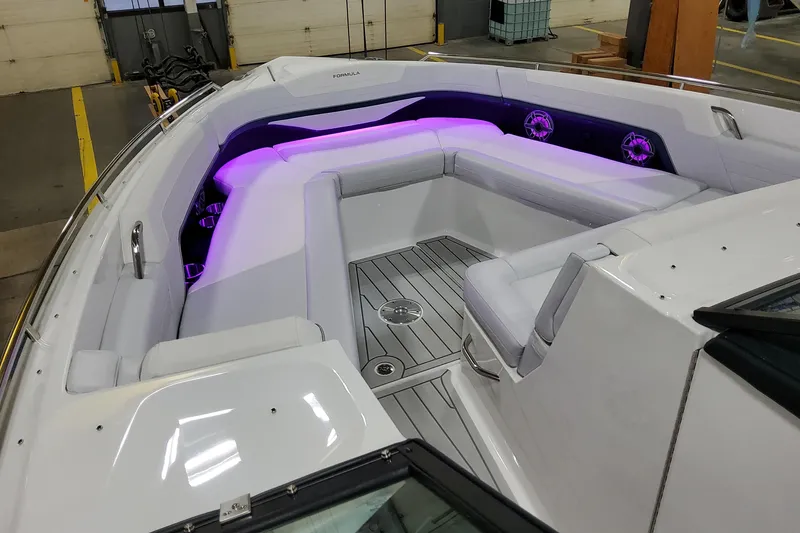 Slide: The Image of 2026 Formula 360 Crossover Bowrider OB with purple LED lighting and spacious seating. - 15