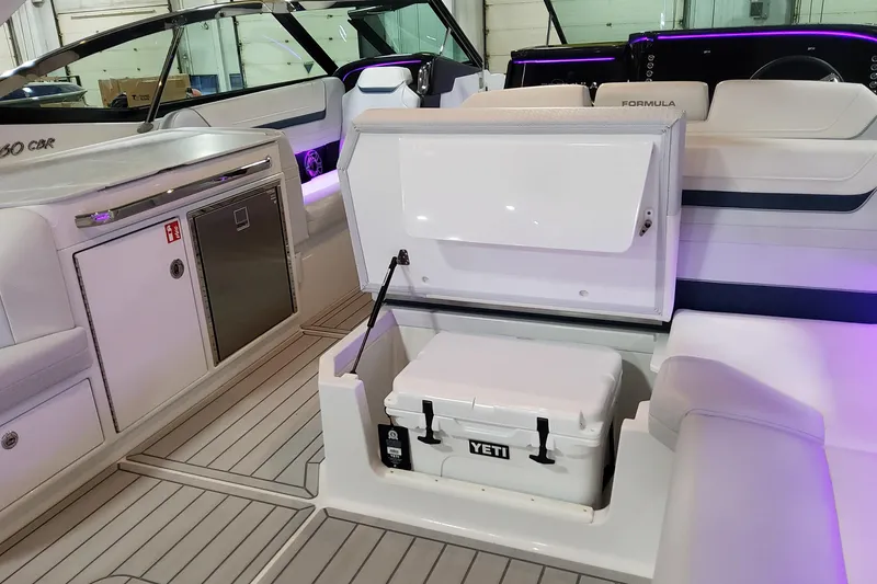 Slide: The Image of 2026 Formula 360 Crossover Bowrider OB interior with Yeti cooler and sleek seating. - 26