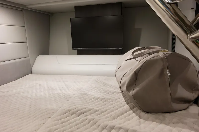 Slide: The Image of Luxurious interior of 2026 Formula 360 Crossover Bowrider OB with TV and duffel bag. - 36