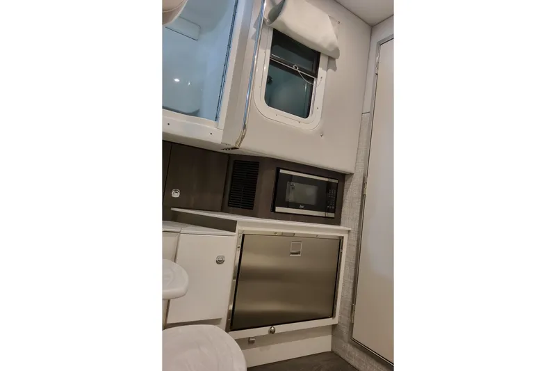 Slide: The Image of Interior of 2026 Formula 360 Crossover Bowrider OB with microwave and storage. - 38