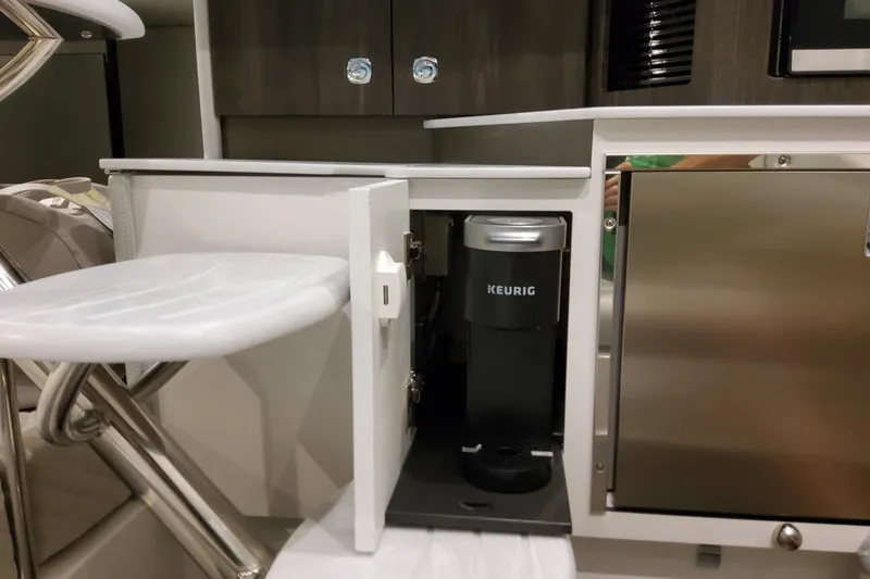 Slide: The Image of 2026 Formula 360 Crossover Bowrider OB interior with Keurig coffee maker in cabinet. - 41
