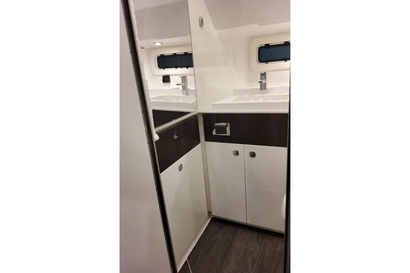 Slide: The Image of Interior of 2026 Formula 360 Crossover Bowrider OB, featuring sleek cabinetry and modern fixtures. - 43