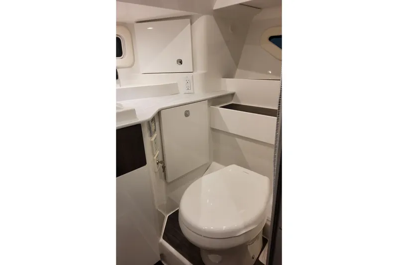 Slide: The Image of 2026 Formula 360 Crossover Bowrider OB bathroom with modern white fixtures and cabinetry. - 44
