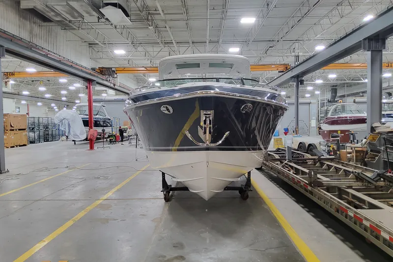 Slide: The Image of 2026 Formula 360 Crossover Bowrider OB in a spacious indoor facility. - 5