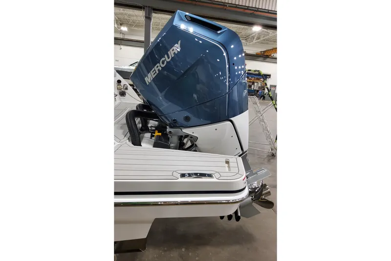 Slide: The Image of 2026 Formula 360 Crossover Bowrider OB with Mercury outboard engine in a showroom. - 7