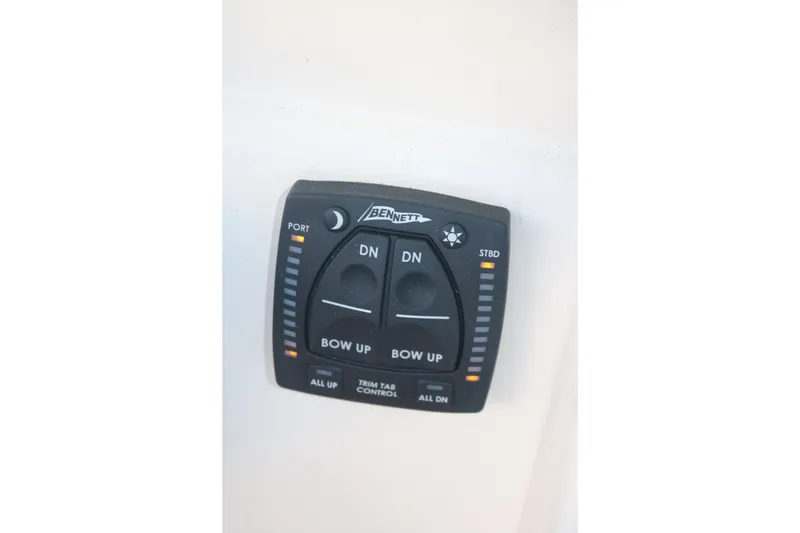 Slide: The Image of Bennett trim tab control panel on 2022 Pioneer 220 Bay Sport boat. - 14