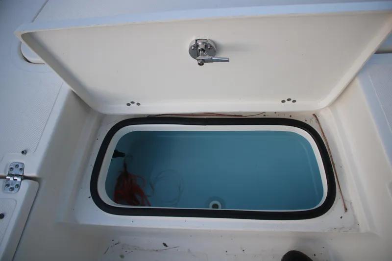 Slide: The Image of Open storage compartment on 2022 Pioneer 220 Bay Sport boat. - 16