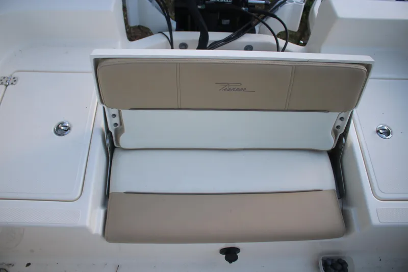 Slide: The Image of 2022 Pioneer 220 Bay Sport boat seat with beige and white upholstery. - 18