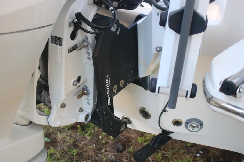 Slide: The Image of Close-up of 2022 Pioneer 220 Bay Sport boat engine mount and Seastar hydraulic steering. - 5