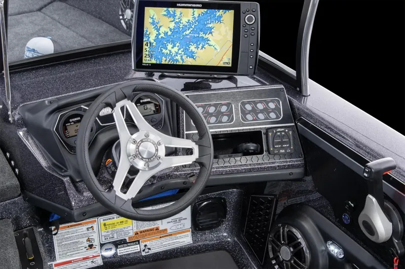Slide: The Image of Manufacturer Provided Image: 2025 Skeeter WX2200 boat dashboard with steering wheel and navigation display. - 12