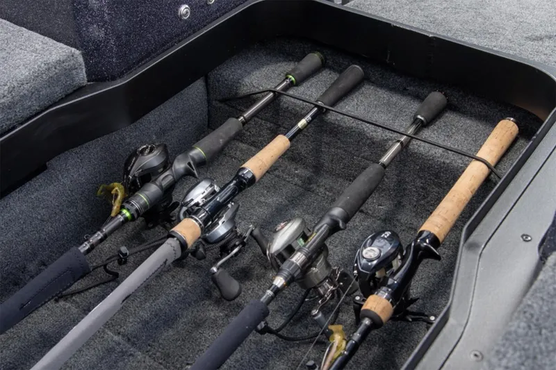Slide: The Image of Manufacturer Provided Image: Fishing rods stored in a 2025 Skeeter WX2200 boat compartment. - 16