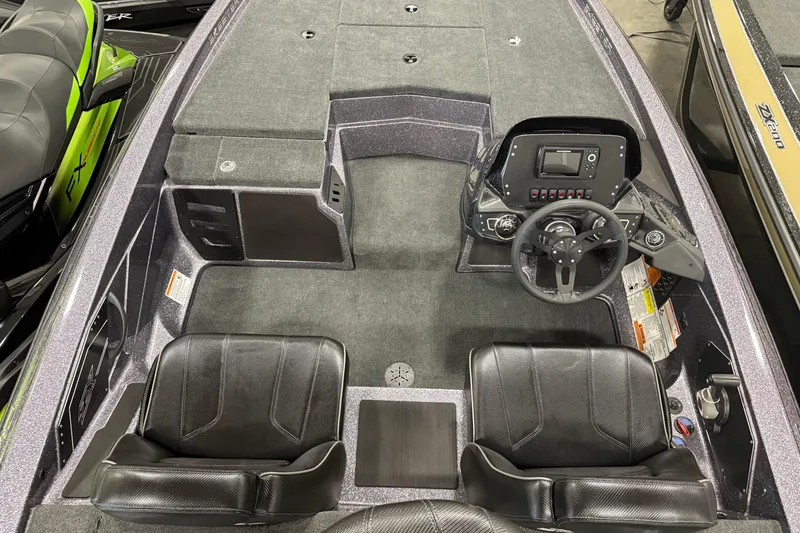 Slide: The Image of 2024 Skeeter ZX150 boat interior with dual seats and modern dashboard controls. - 4